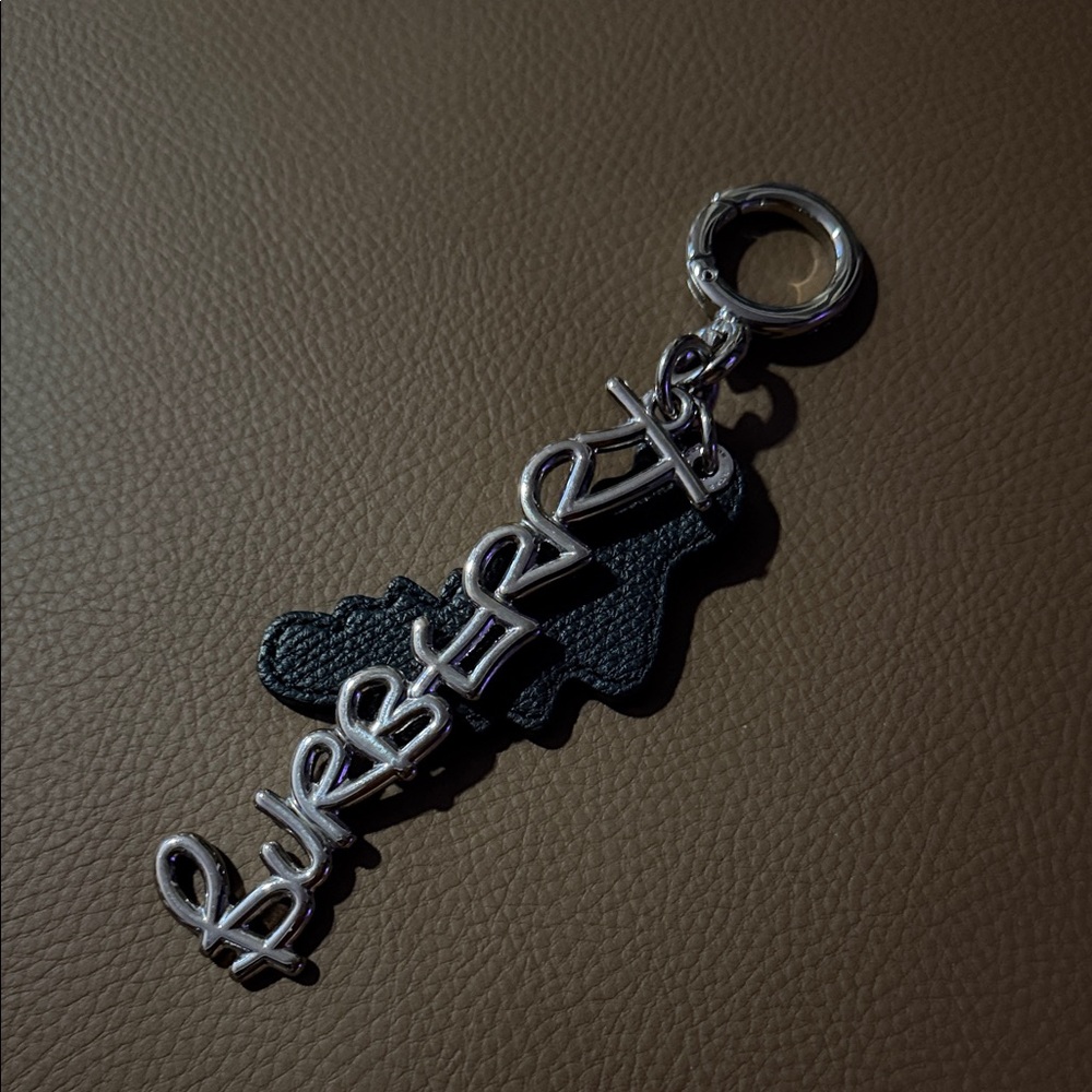 Authentic Burberry Silver and Black leather Keychain bag charm